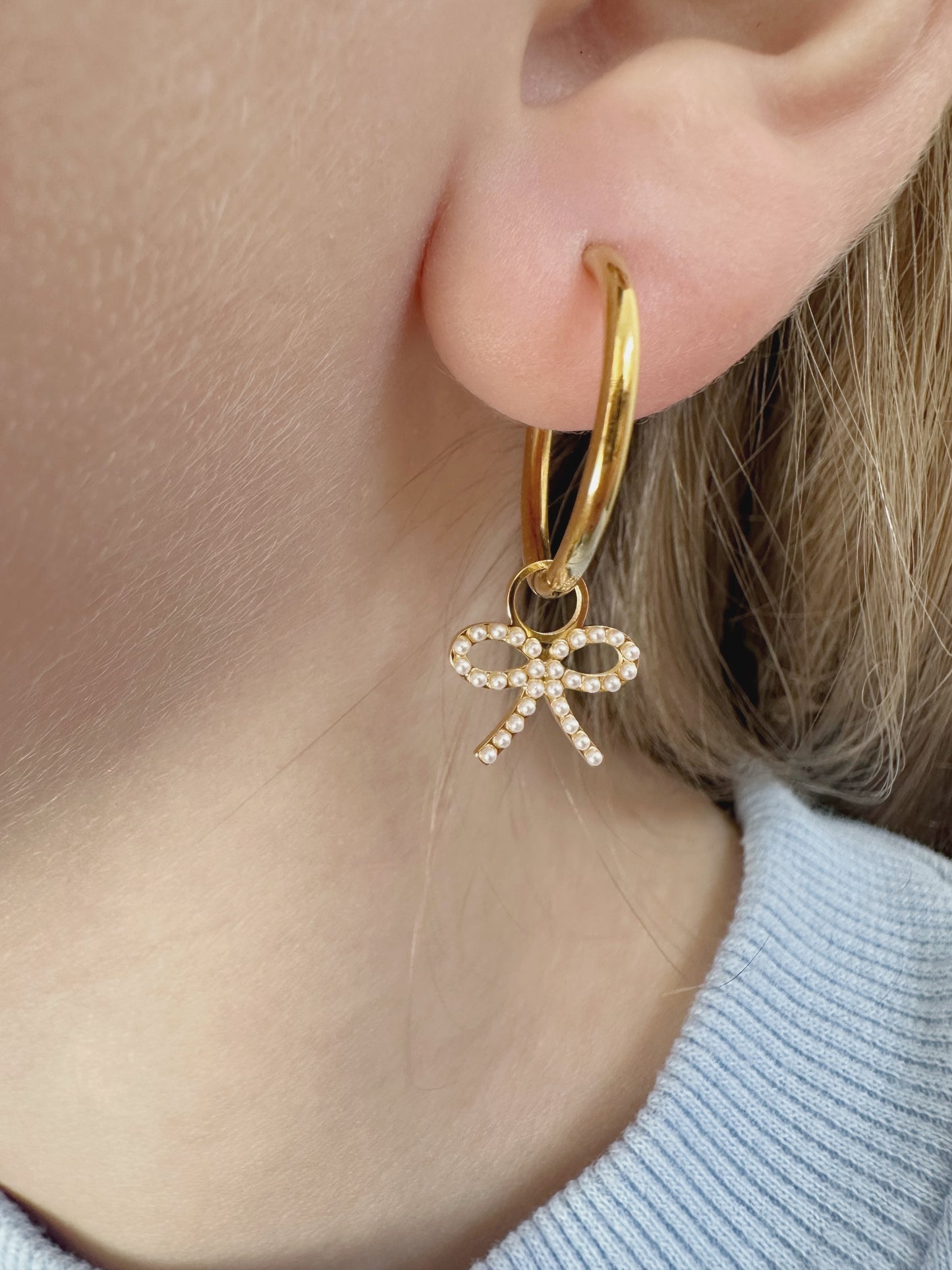 gold hoops with pearl bow charm