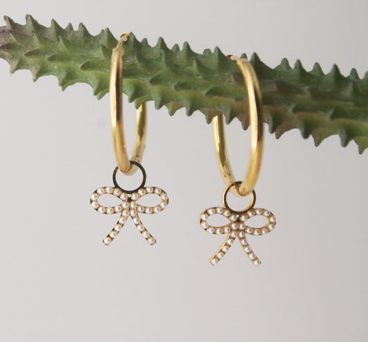 gold hoops with pearl bow charm